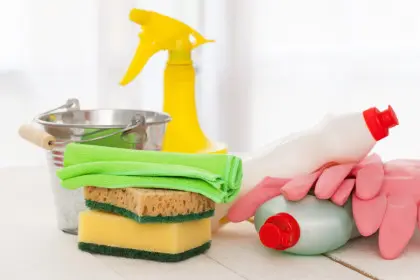 Bright colorful cleaning set wooden table 900x600