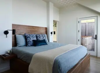 House on the Bluff Hero Interior Master Bedroom Oceanfront View Modern Contemporary