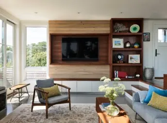 House on the Bluff Hero Interior Built in Living Room Front Entry Entertainment Center Contemporary Modern