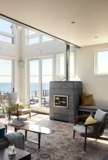 House on the Bluff Tall Interior Living Space Tulikivi Fireplace Cape Cod Interior Design Architecture Modern Contemporary