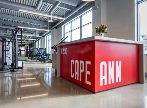 Glen T Mac Leod Cape Ann YMCA Hero Gloucester MA North Shore Architecture Interiors Interior Design Nautical Sails Lighting Fitness Area Second Floor Cardio Wellness Desk 2022 12 16 124640 vmsl