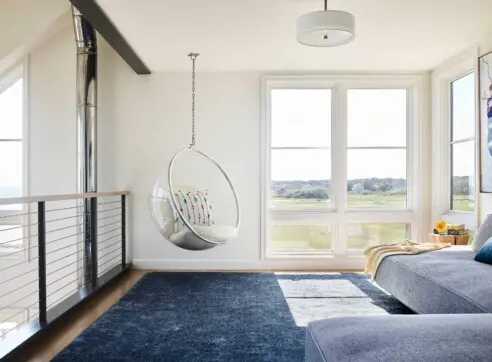 House on the Bluff Hero Interior Loft Space Living Lounge Steel Beam Hanging Chair 2022 12 16 124459 vmdz