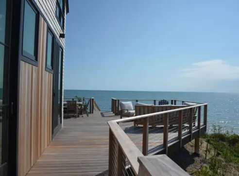 House on the Bluff Hero Exterior Andersen Windows Shingle Style Cape Cod Costal Waterfront View Deck Architecture Landscape 2022 12 16 124509 tnnr