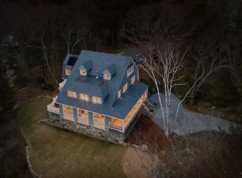 This Old House Gray Lodge Hero Exterior Glowing Aerial 2022 12 16 124616 wpcn