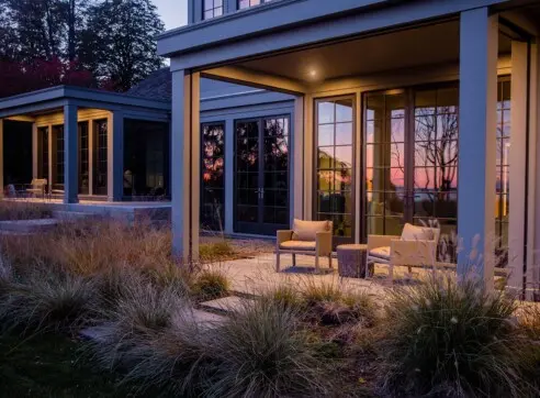 Inside Out Hero Exterior Patio Studio Side of House Accessory Building Barn Shingle Style Modern Contemporary Detail Sitting Area Coastal 2022 12 16 124704 rzzc